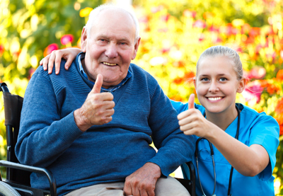 Nurse and patient giving a thumbs up